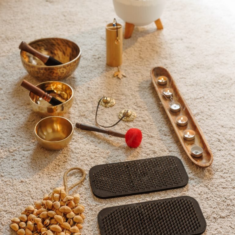 Meditation accessories and yoga props arranged for mindfulness, sound healing, and wellness rituals at home